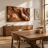 Wide wood wall art carved with flowing ridges like a contour map beside a dining table in natural light