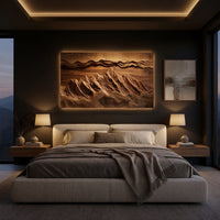 Wide landscape wall relief with layered sky bands above a bed in a dusk lit bedroom