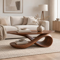 Oval top coffee table on a swooping ribbon pedestal with an oval base disc in a Scandinavian living room with white walls