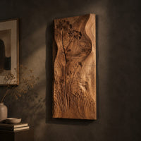 Tall wooden wall art panel with carved wildflowers and a wavy edge, three-quarter view showing the carved depth