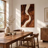 Tall wood wall art panel with a winding cream channel through dark swirling grain beside a dining table in natural light