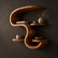 Sculpted wall shelf in an s shape with a hooked top and small ledges, three-quarter view showing the grain