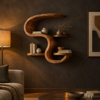 Sculpted wall shelf in an s shape with a hooked top and small ledges in a dark living room at golden hour