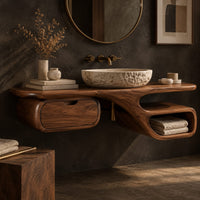 Corner detail of floating bathroom vanity with a long slab top, drawer pod and open loop niche beside wood, brass and linen samples