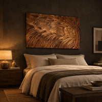 Large rectangle wooden wall panel carved with deep flowing windswept strands above a bed in a dusk lit bedroom