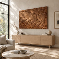 Large rectangle wooden wall panel carved with deep flowing windswept strands above a light oak sideboard in daylight