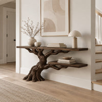 Console table with a leaning tree root base and one lower shelf in a Scandinavian entryway with white walls