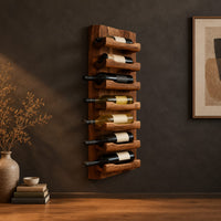 Tall wine rack with stacked angled cradle arms on a slab backboard in a dark studio against a charcoal plaster wall
