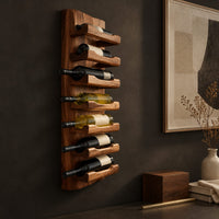 Corner detail of tall wine rack with stacked angled cradle arms on a slab backboard beside wood, brass and linen samples