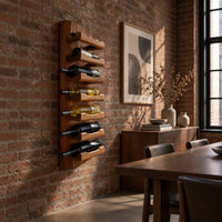 Tall wine rack with stacked angled cradle arms on a slab backboard in an industrial loft dining room with exposed brick