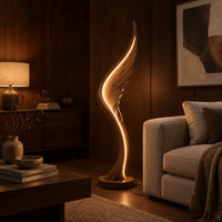 Wing shaped wooden floor lamp with a glowing edge line in an evening living room with walnut wall paneling