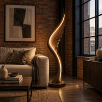 Wing shaped wooden floor lamp with a glowing edge line in an industrial loft living room with exposed brick
