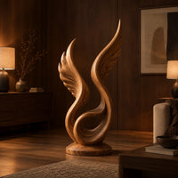 Winged swirl sculpture with carved feather lines on a disc base in an evening living room with walnut wall paneling