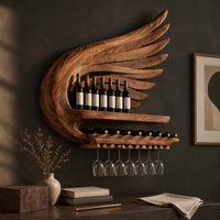 Corner detail of wing shaped wine rack with feathered carving, a bottle shelf and a stemware rail beside wood, brass and linen samples