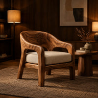 Wraparound lounge chair with arched cutout arms and an upholstered seat in an evening living room with walnut wall paneling