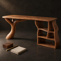 Corner detail of desk with a branch shaped leg and a wavy open shelf unit beside wood, brass and linen samples