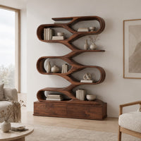 Zigzag bookshelf of stacked open oval loops on a wide base in a Scandinavian living room with white walls