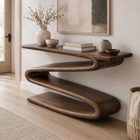 Console table with a continuous zigzag ribbon base and a flat slab top in a Scandinavian entryway with white walls