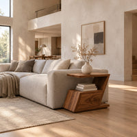 Zigzag side table with an angled top, open niche and slanted lower box in a bright open plan living room